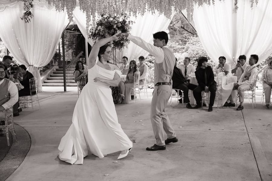 Bride and groom sharing their first dance during their wedding reception at Gassaway Mansion.
