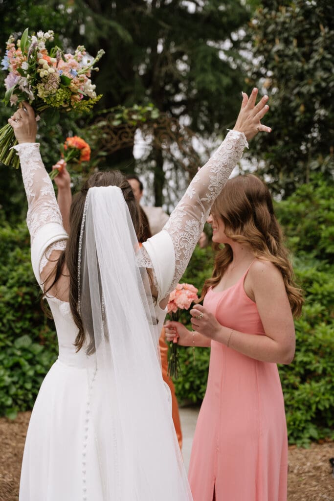 Bride celebrating with her bridal party after the wedding ceremony.